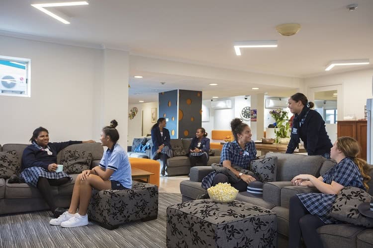 Ipswich Girls' Grammar School students relaxing in the common area and enjoying afternoon tea.