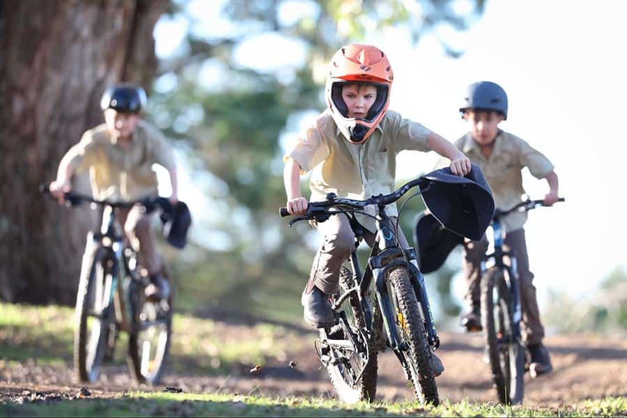 3 students mountain biking at The King's School Tudor House